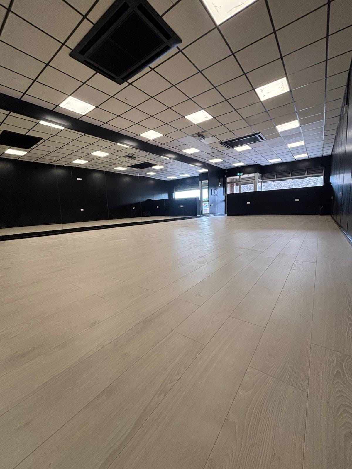 Empty dance studio with mirrors and sprung floor ready for hire